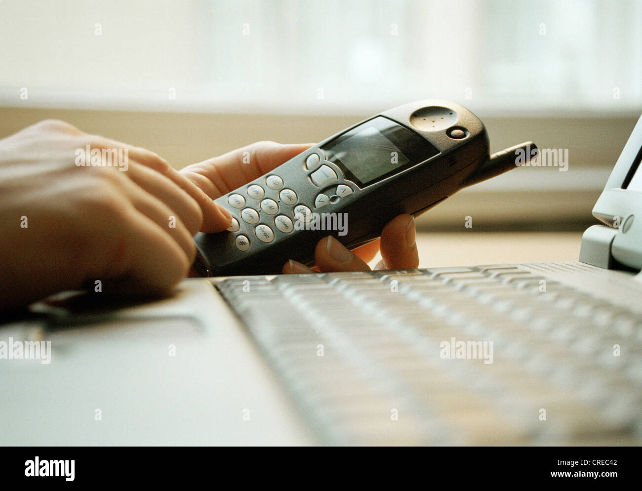 User of computer and mobile phone Stock Photo - Alamy