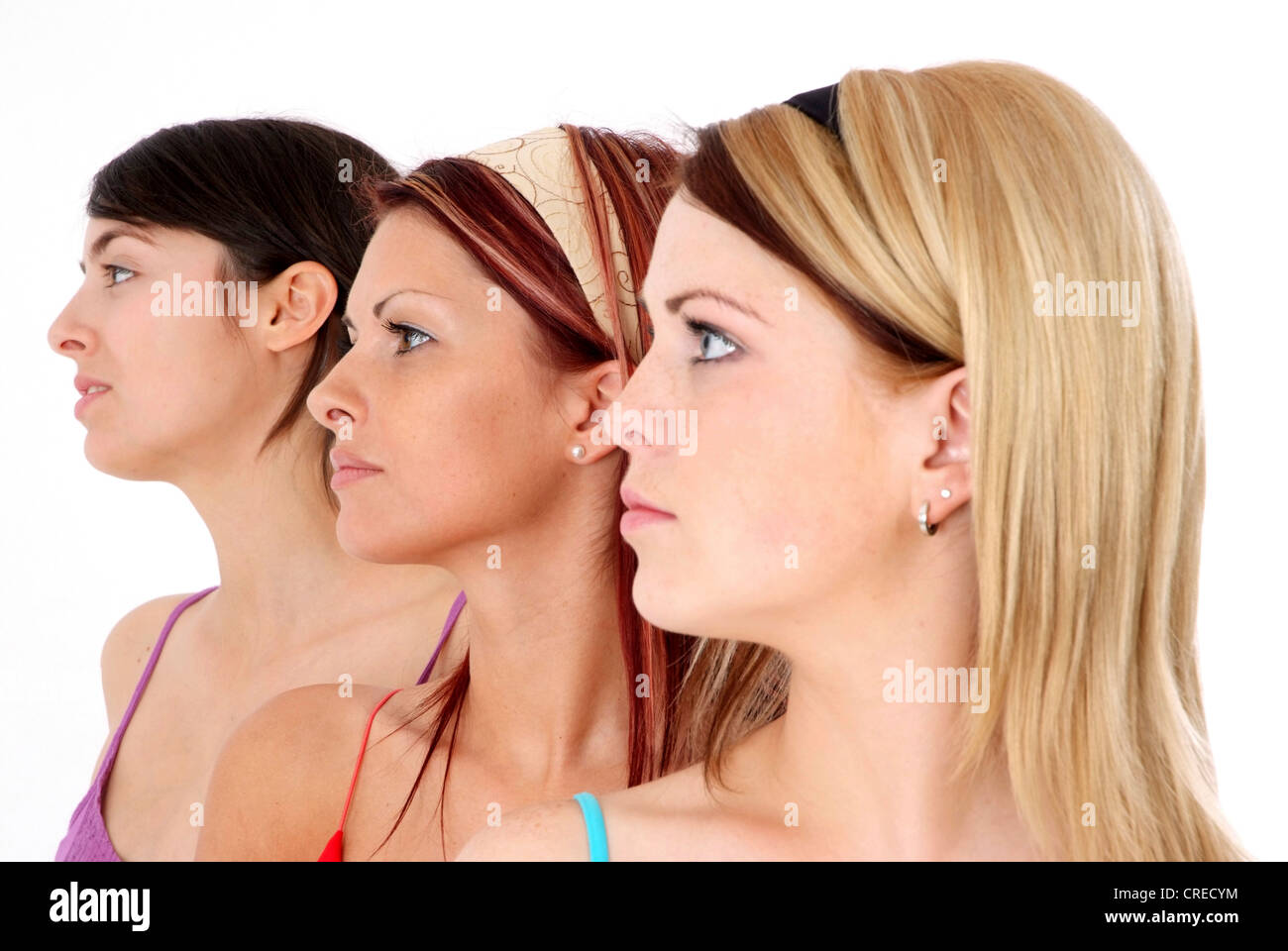 three young, attractive women in side-face Stock Photo