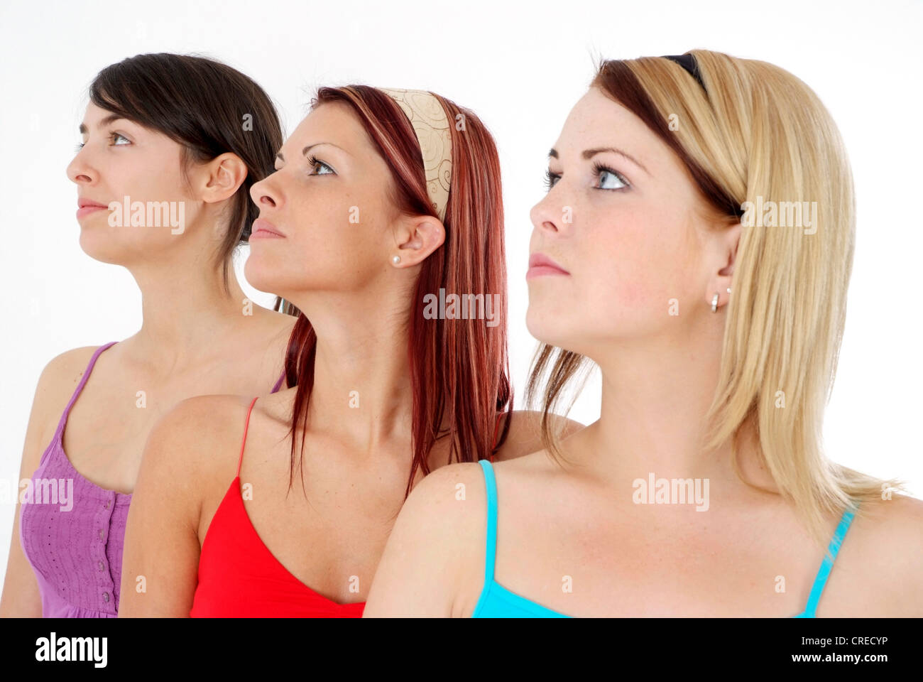 three young, attractive women in side-face Stock Photo