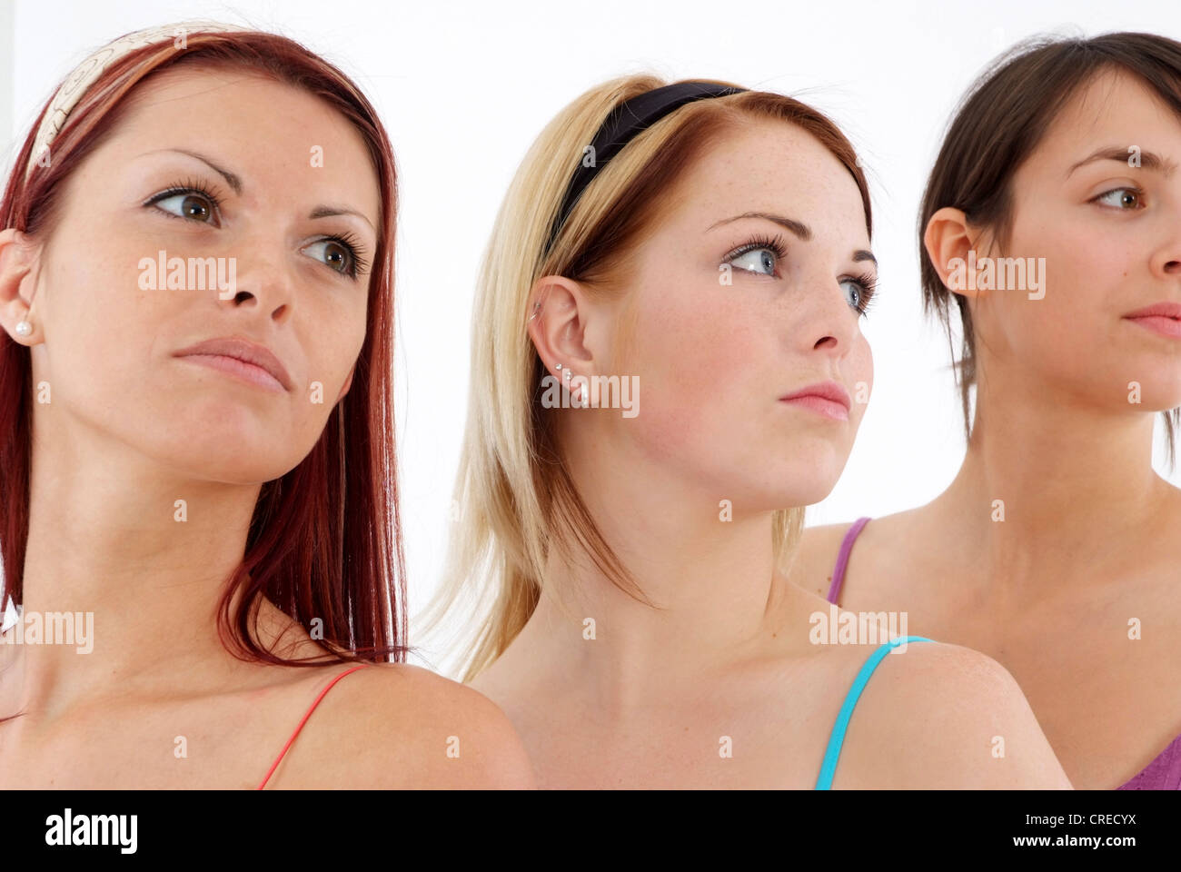 three young, attractive women in side-face Stock Photo