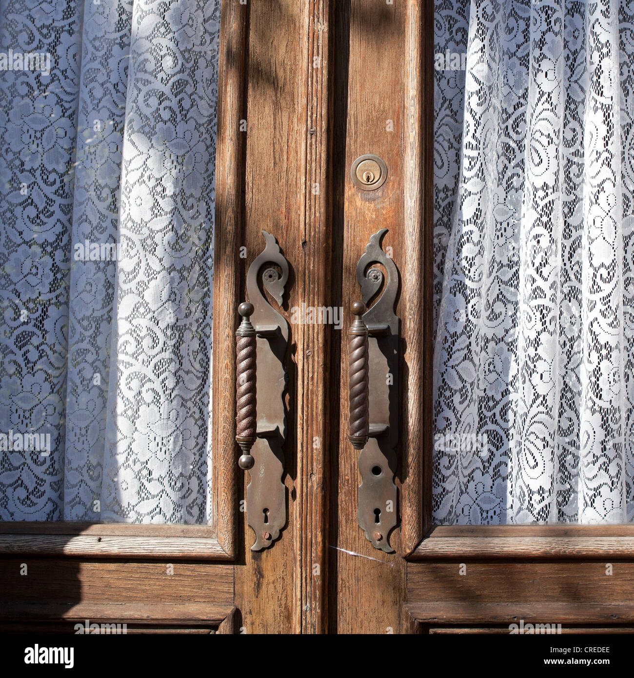 Lace Curtains Accent A Wooden Door In The Park Slope Neighborhood