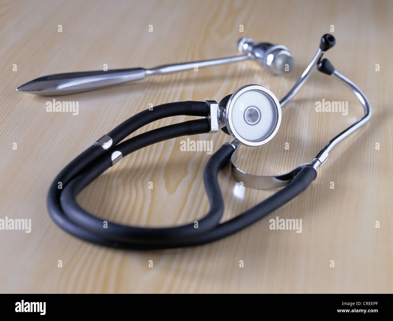 Stethoscope and reflex hammer on a table Stock Photo Alamy
