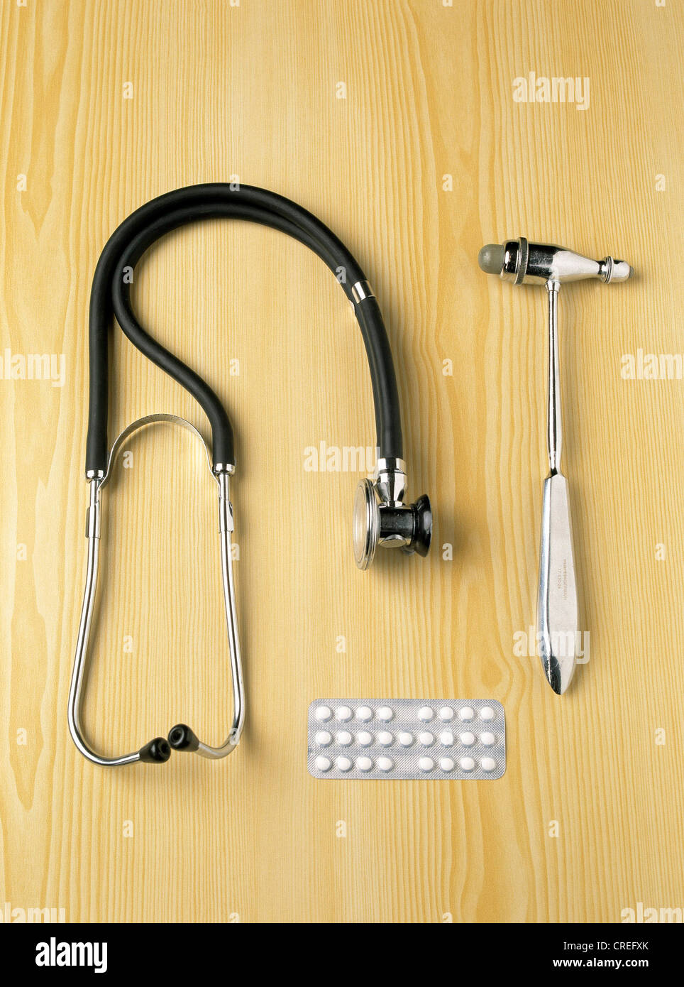 Stethoscope, reflex hammer and drugs on a table Stock Photo Alamy