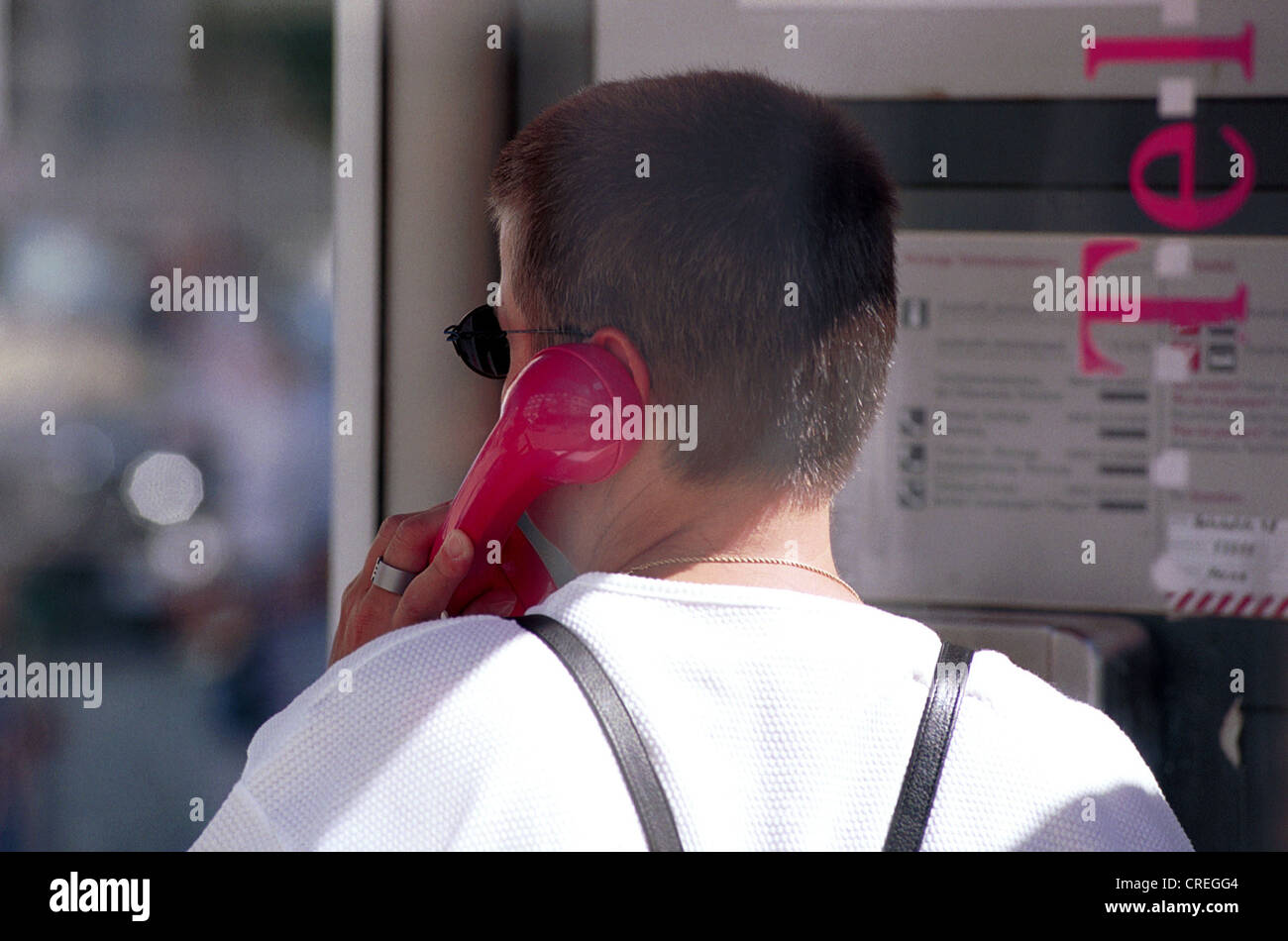 Woman in phone booth, Herne, Germany Stock Photo