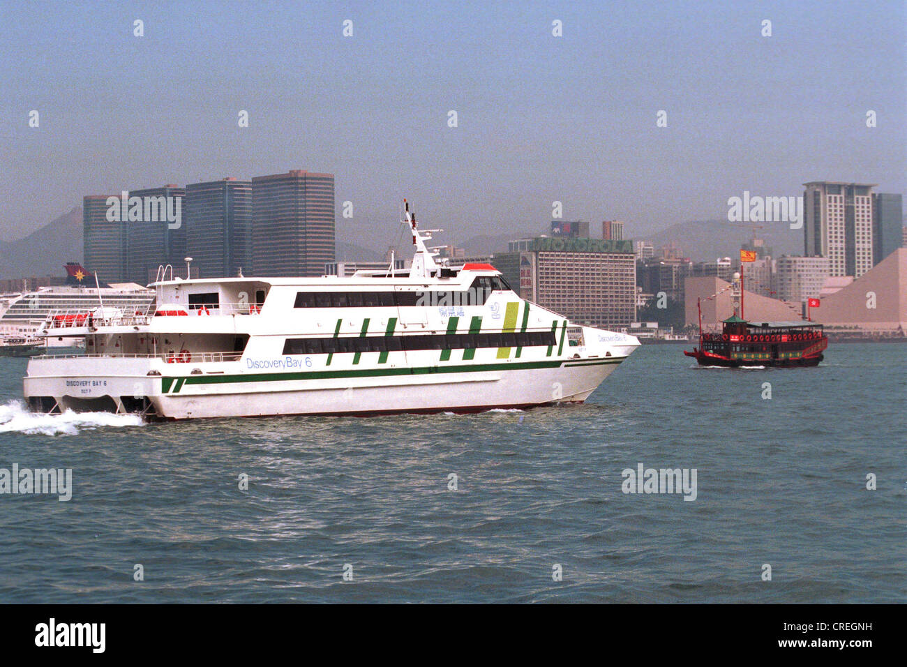 Old and new boat in Victoria Harbour in Hong Kong Stock Photo