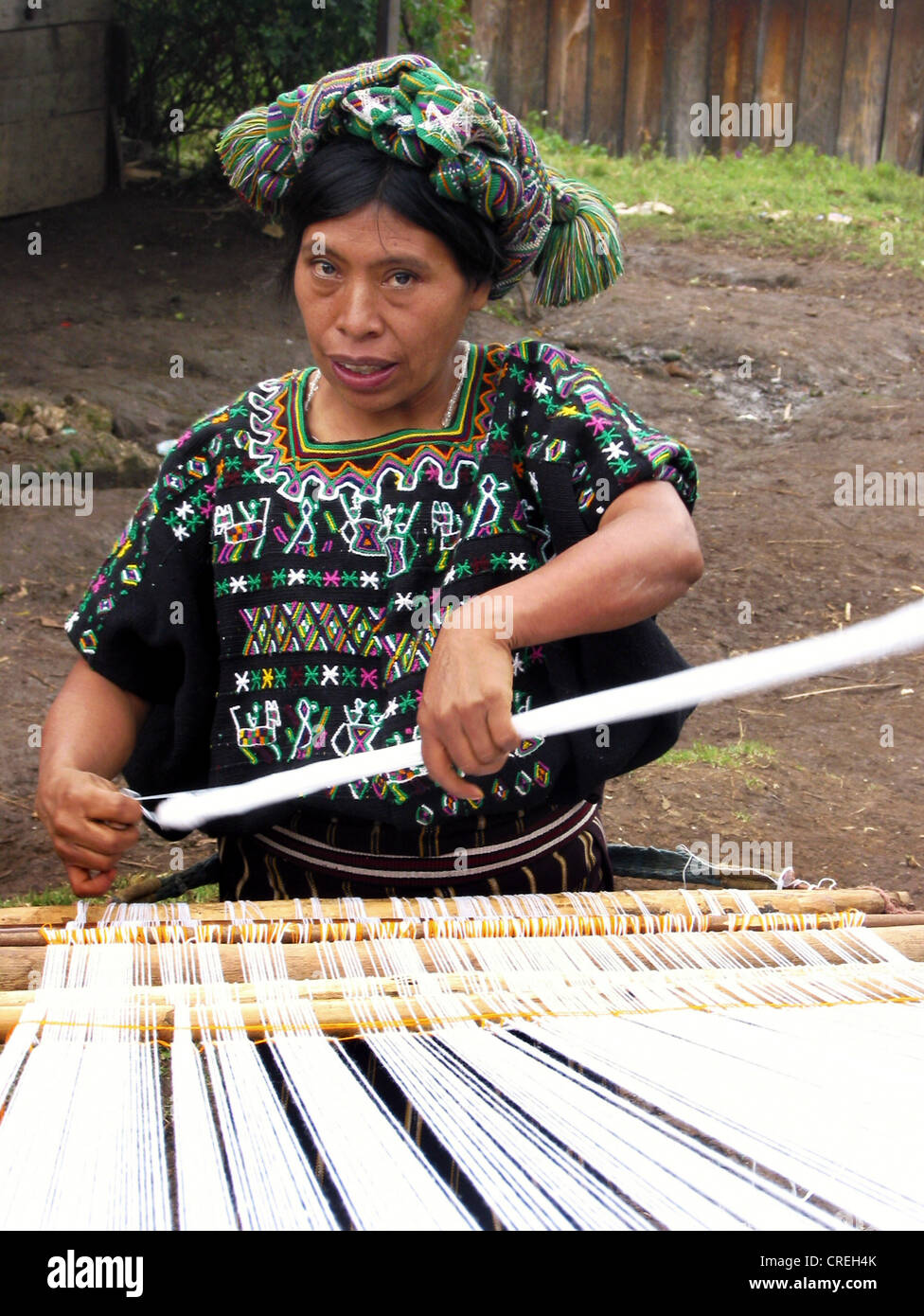 Mayan woman weaving in traditional costume in a village close to Nebaj, Guatemala, Quich�, Nebaj Stock Photo