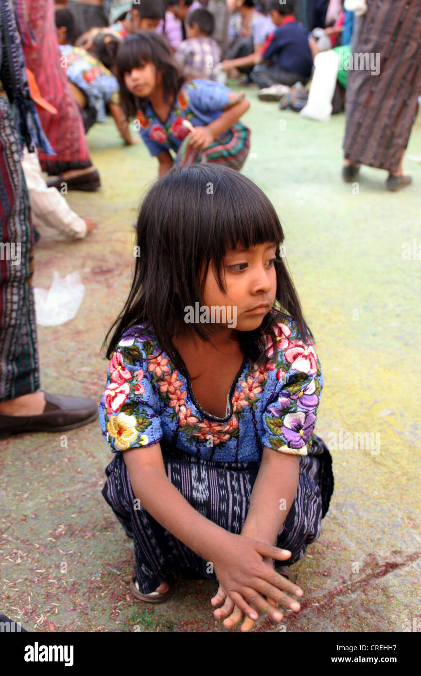 Mayan child with confetti in the middle of a Maya procession in Santiago de Atitlan, Guatemala, Atitlansee, Santiago de Atitlan Stock Photo