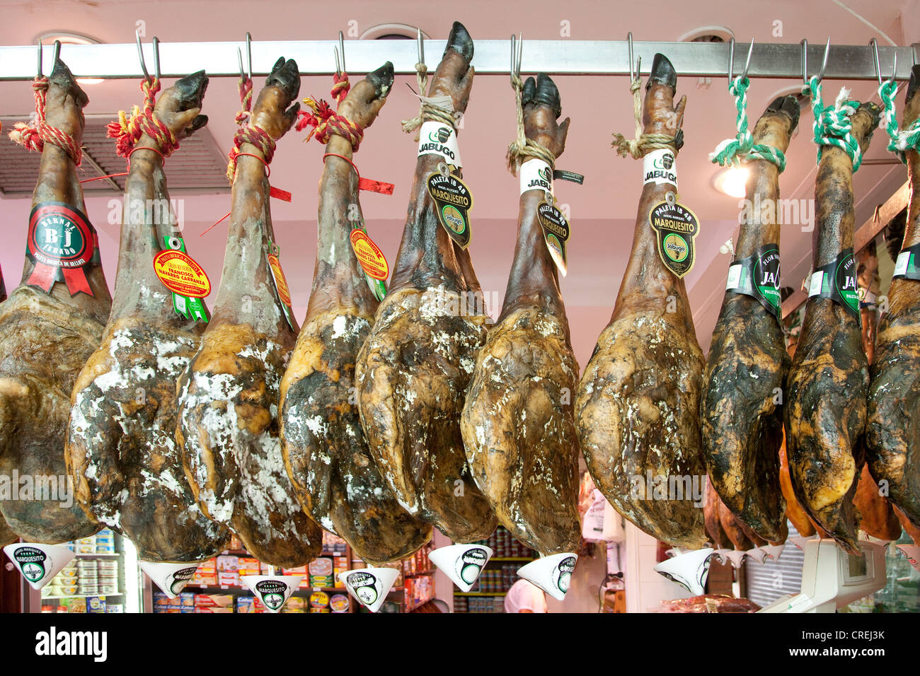 Serrano ham in the market hall, market, Mercado de Triana, Seville, Andalucia, Spain, Europe Stock Photo