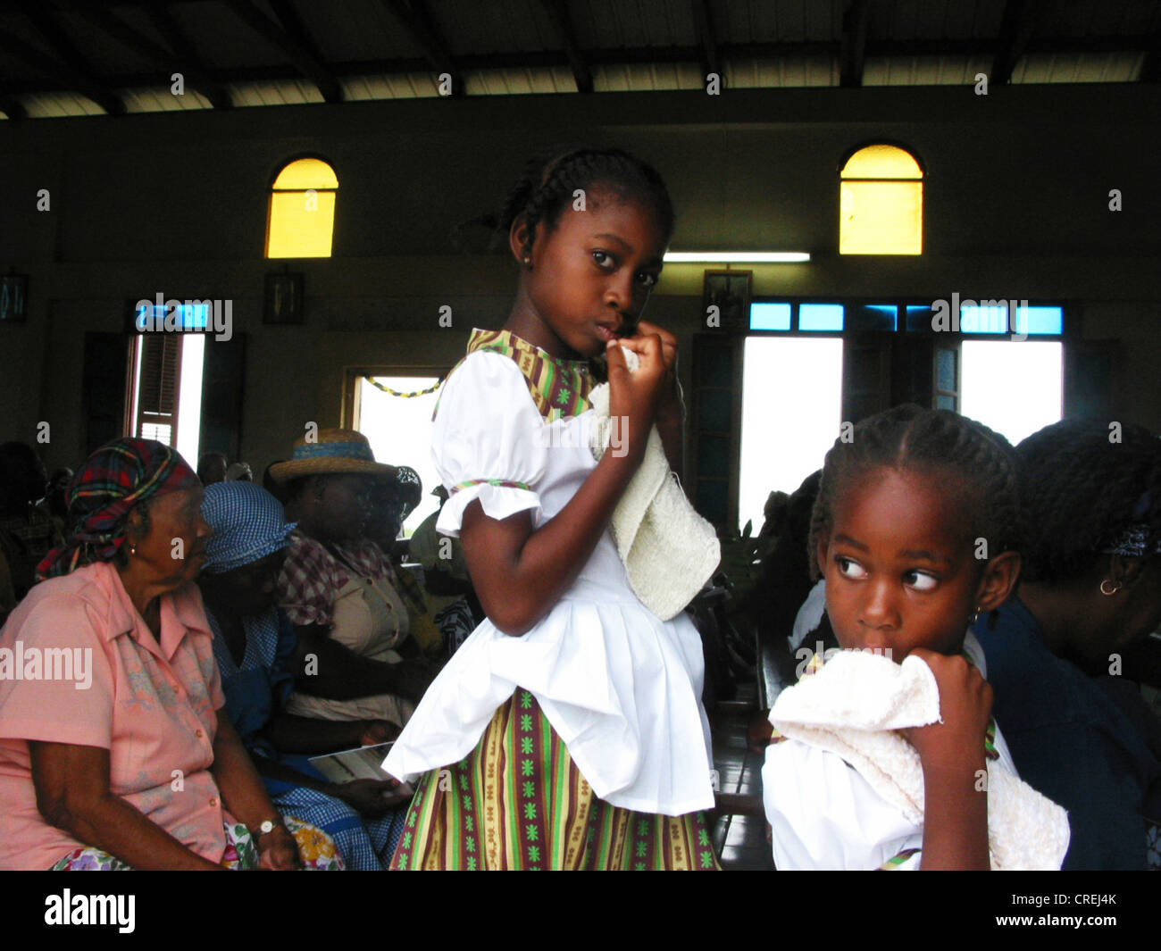 Young Garifuna, a descendant of black slaves, in church, Belize, Stann Creek District, Hopkins Stock Photo