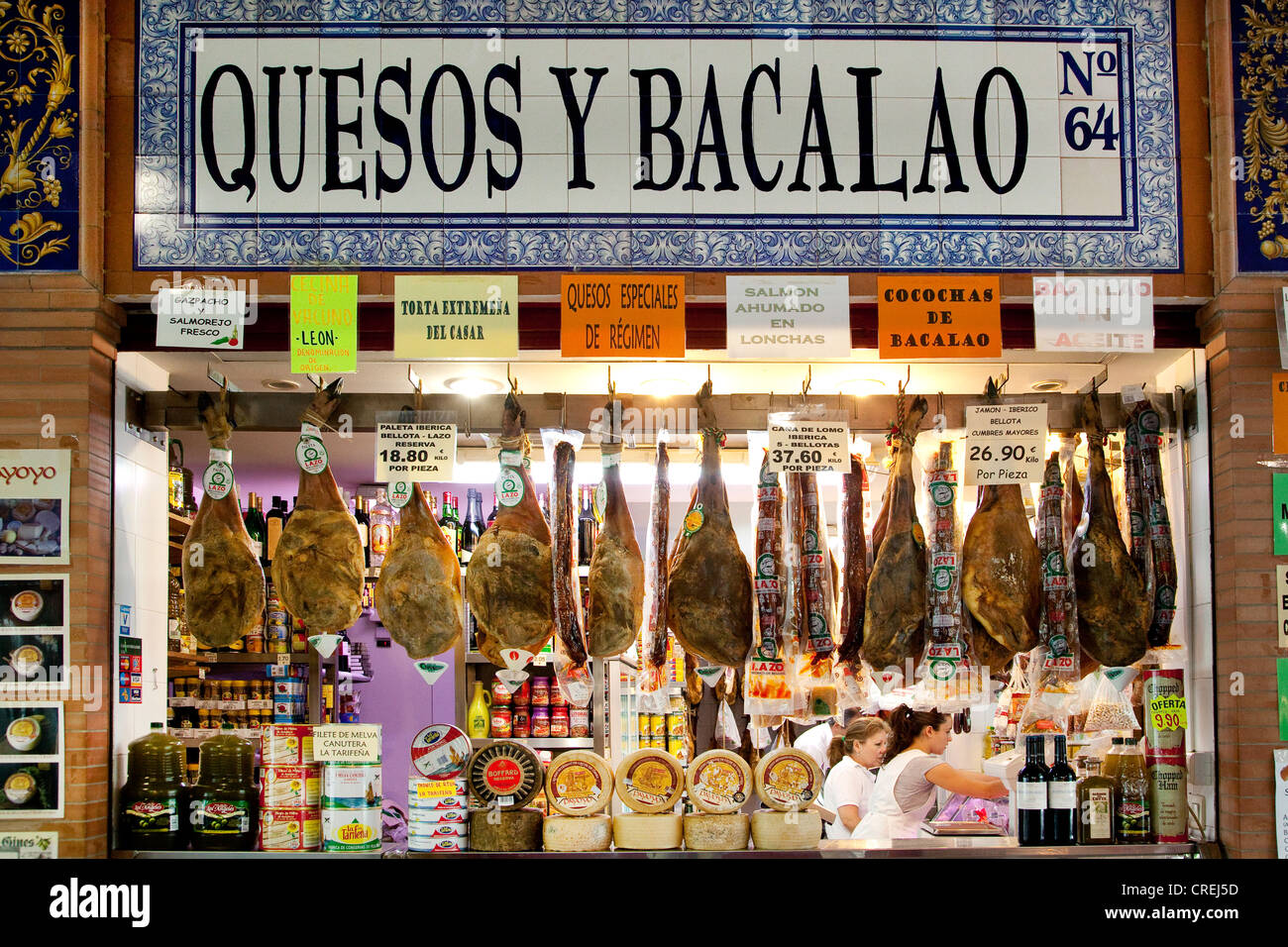 Market hall, Mercado de Triana, with cheese, ham, Serrano ham and fish, Seville, Andalusia, Spain, Europe Stock Photo