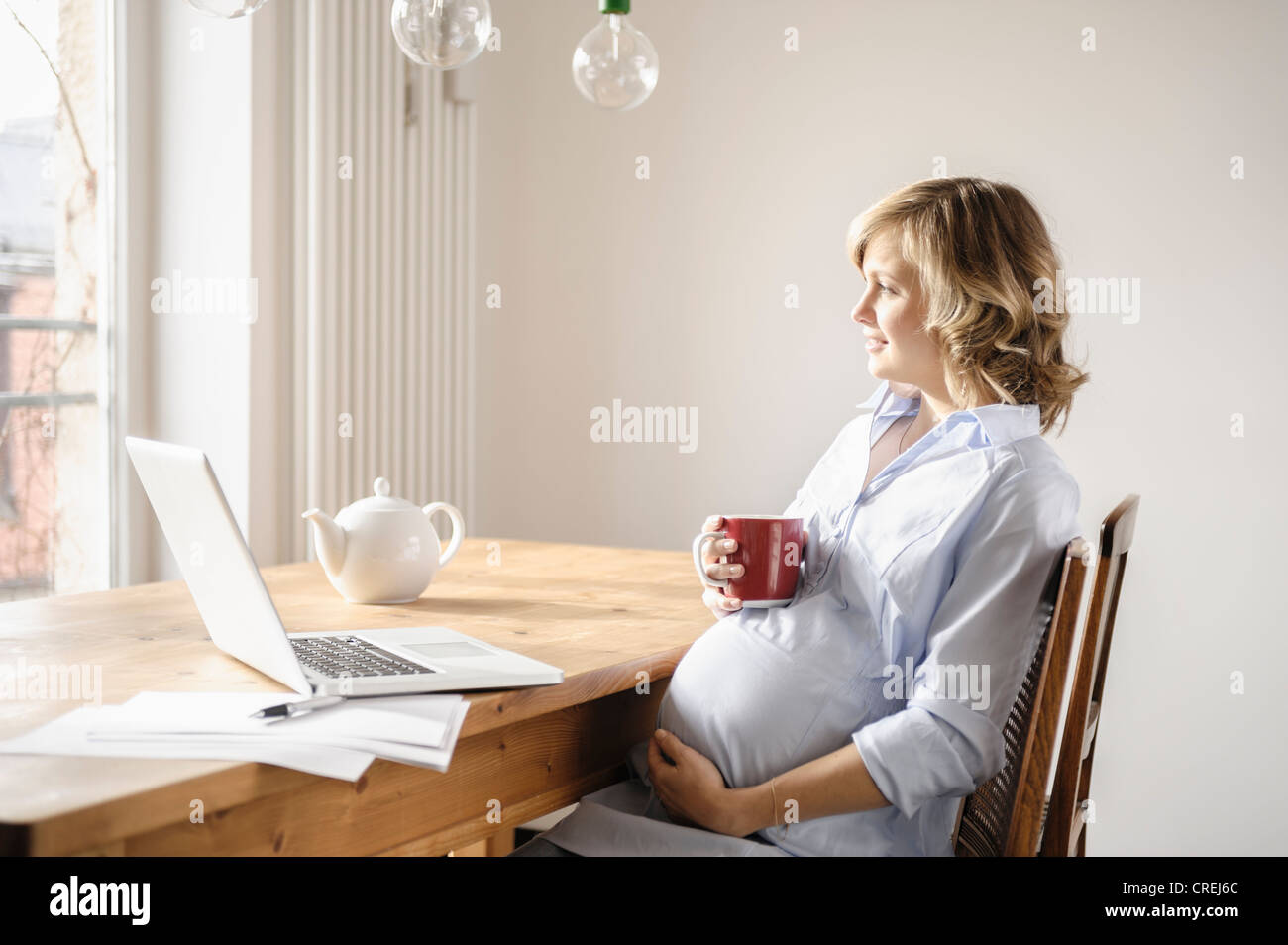 Pregnant woman having cup of coffee Stock Photo Alamy