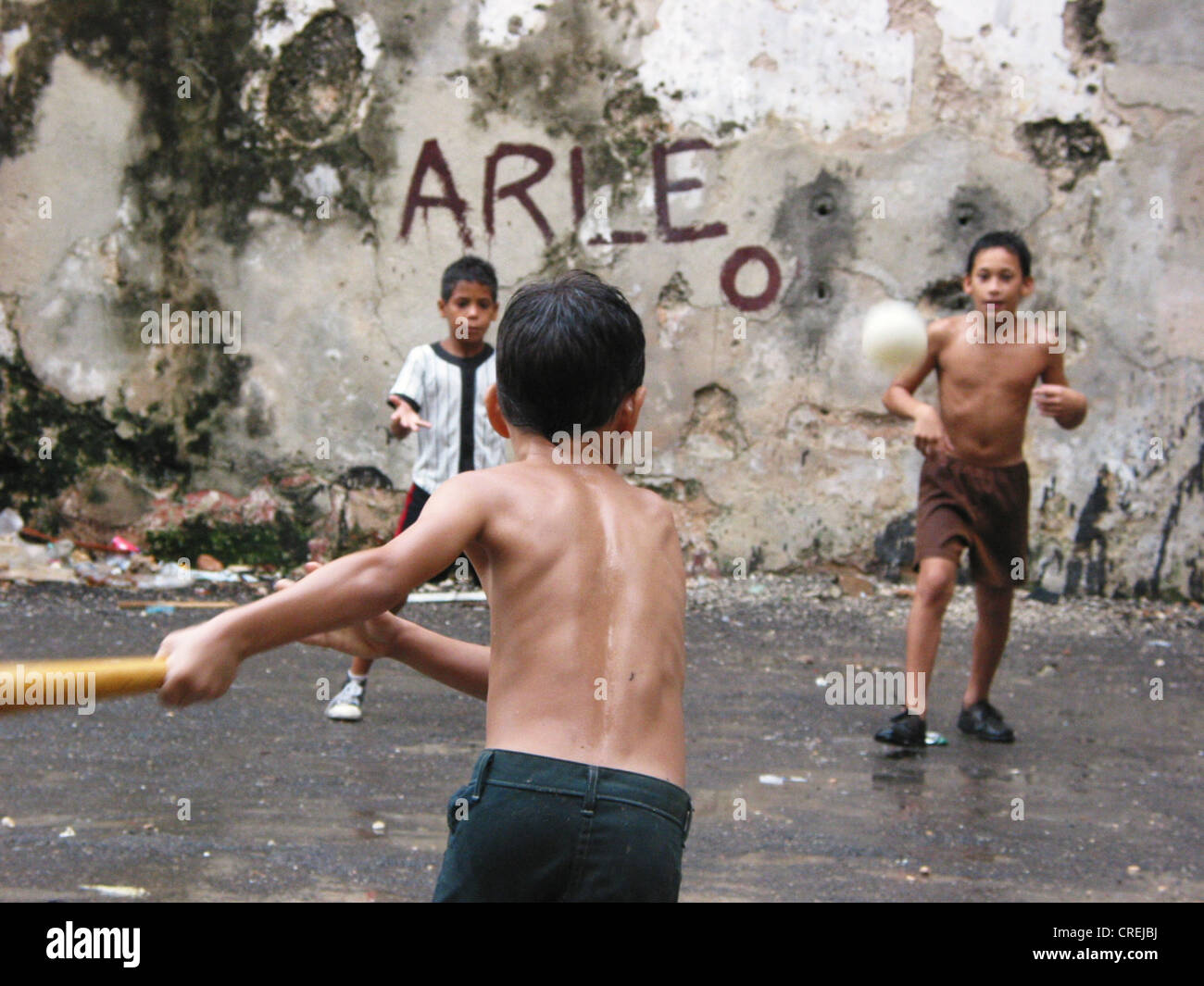 children playing baseball in a backyard in the old town, Cuba, La Habana Stock Photo