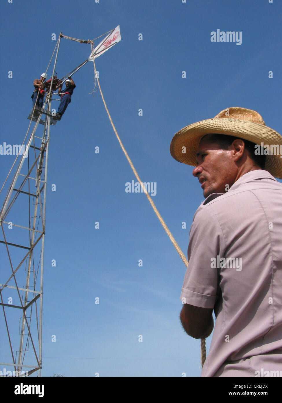 farmer constructing windmill for conveying water, Cuba, Holguin Stock Photo