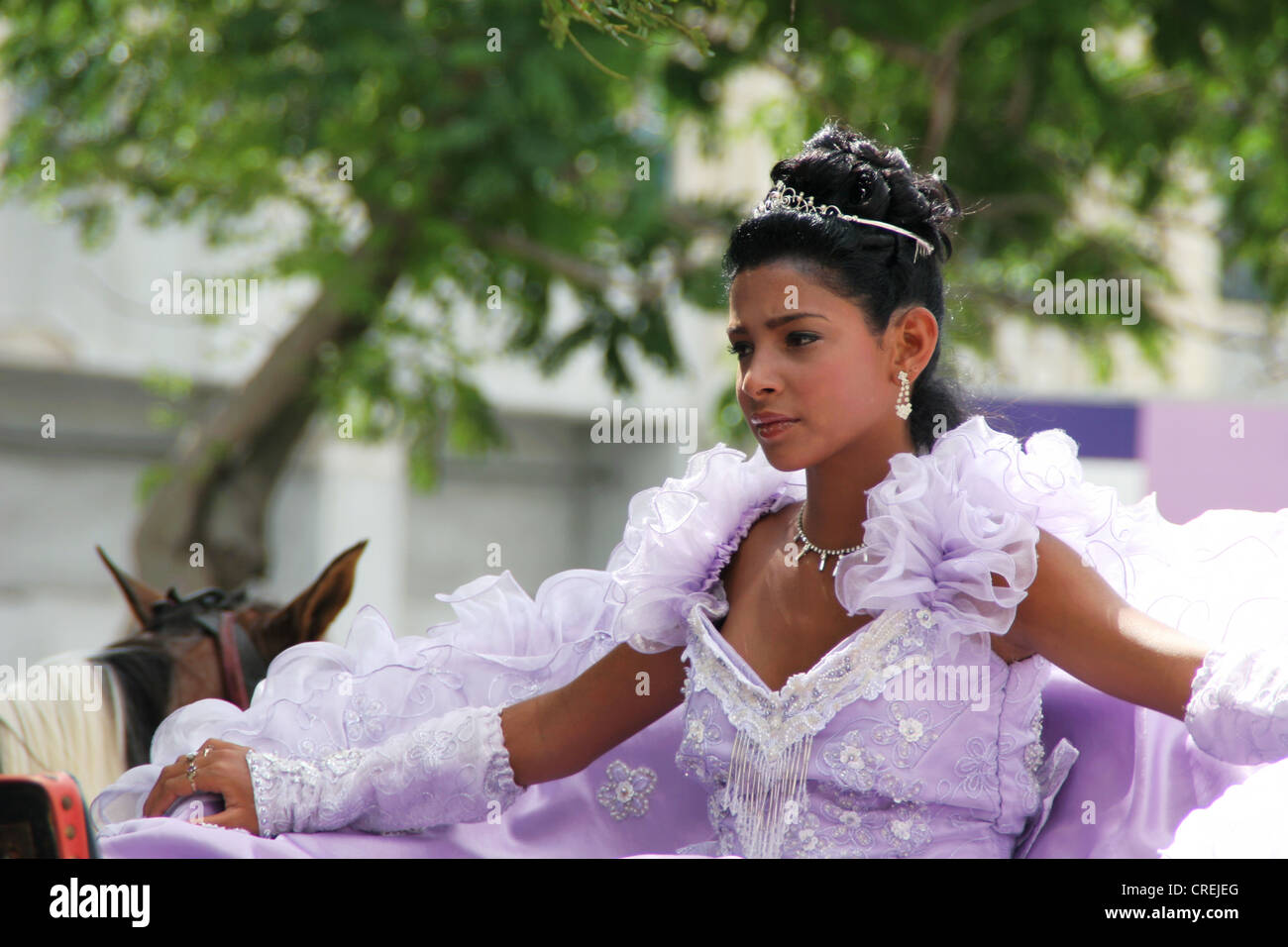 girl in festive dress celebrating the Quincea�erain in the old town, Cuba, La Habana Stock Photo