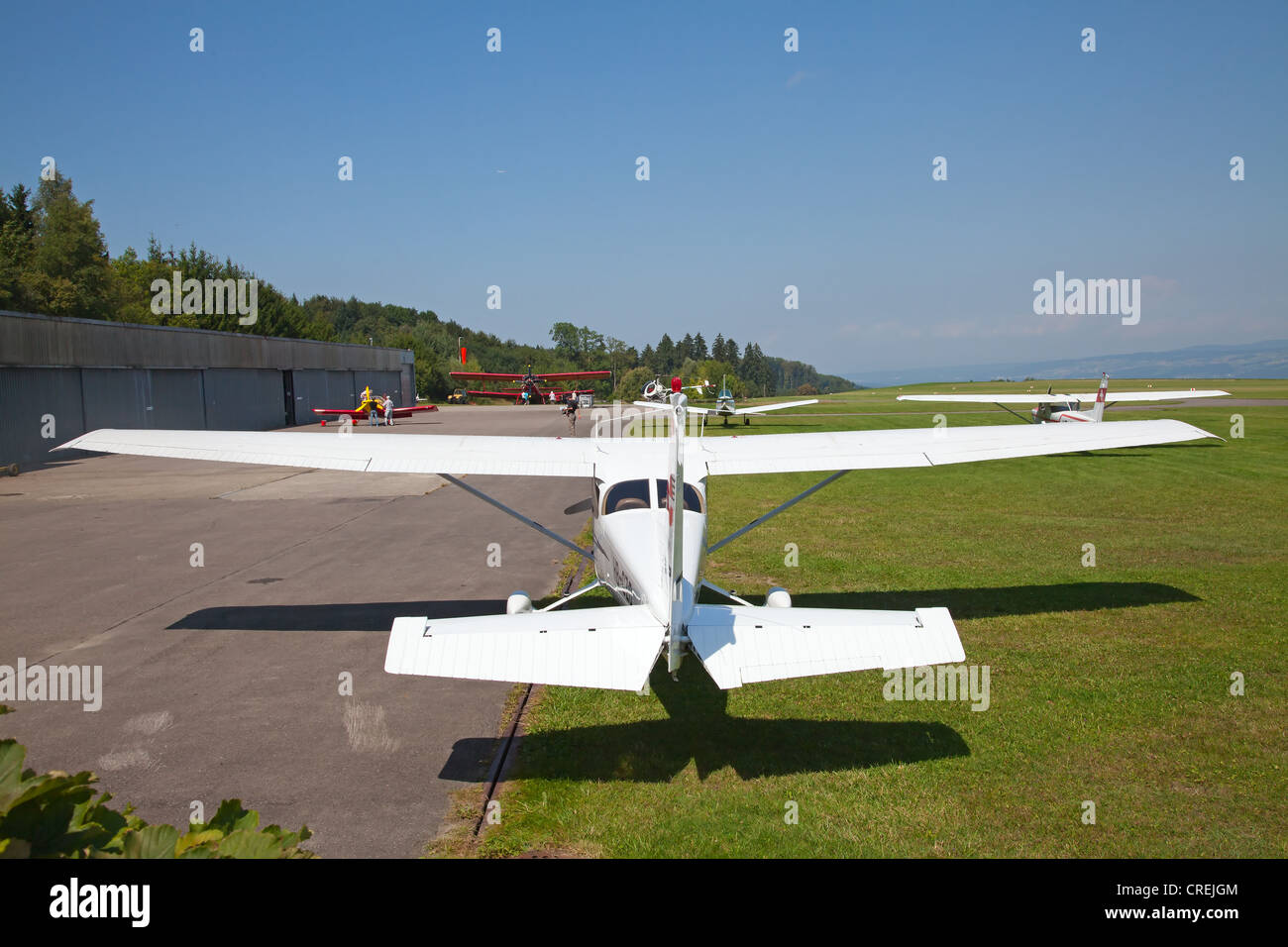 small airplane waiting on field Stock Photo - Alamy