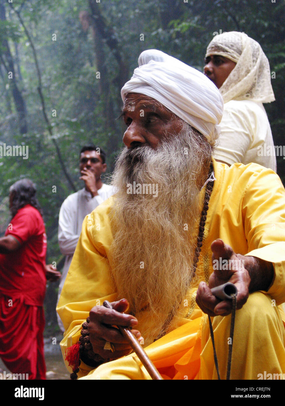 Hindu priests with long white beard in a river ritual in the north of the carribean island Trinidad, Trinidad and Tobago, Trinidad Stock Photo