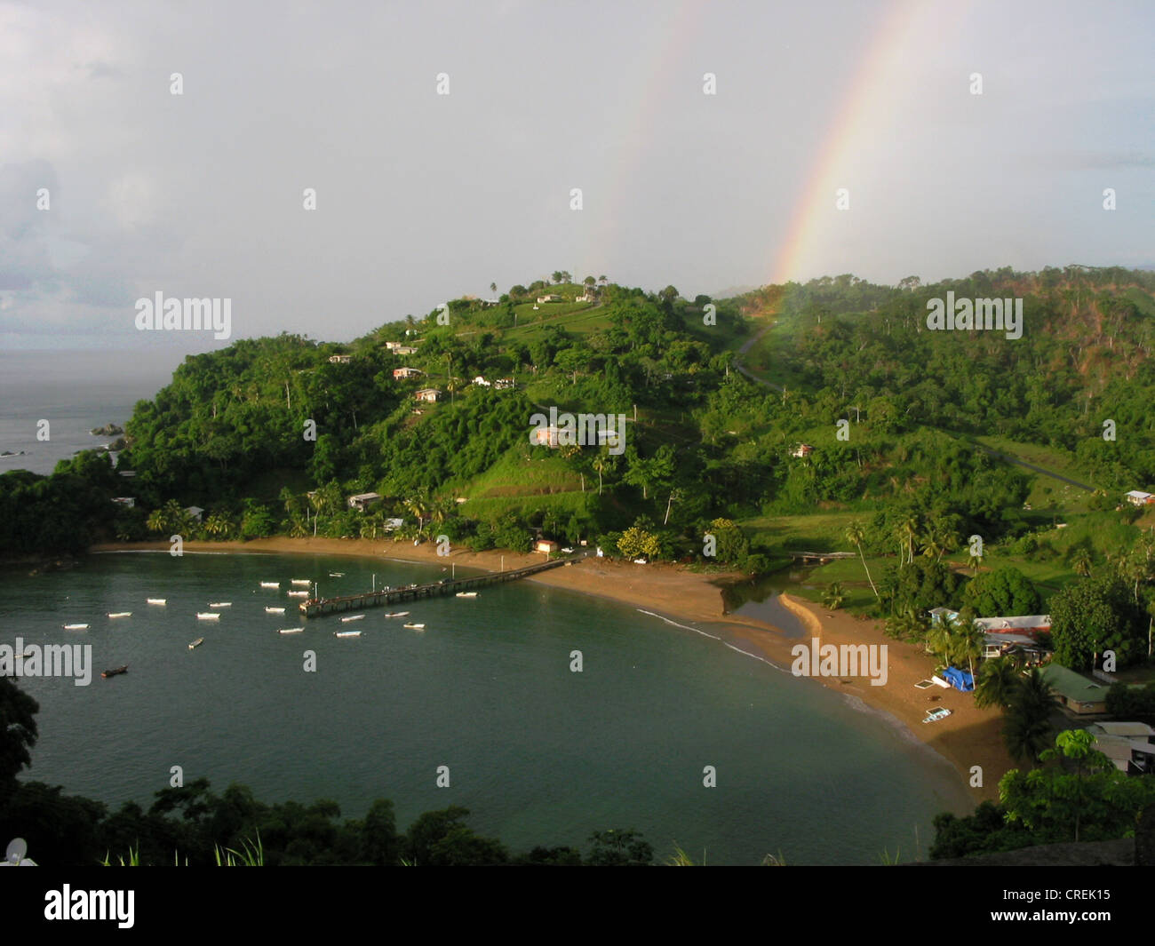 Beautiful bay in the evening atmosphere with rainbow, Trinidad and Tobago, Tobago, Port of Spain Stock Photo