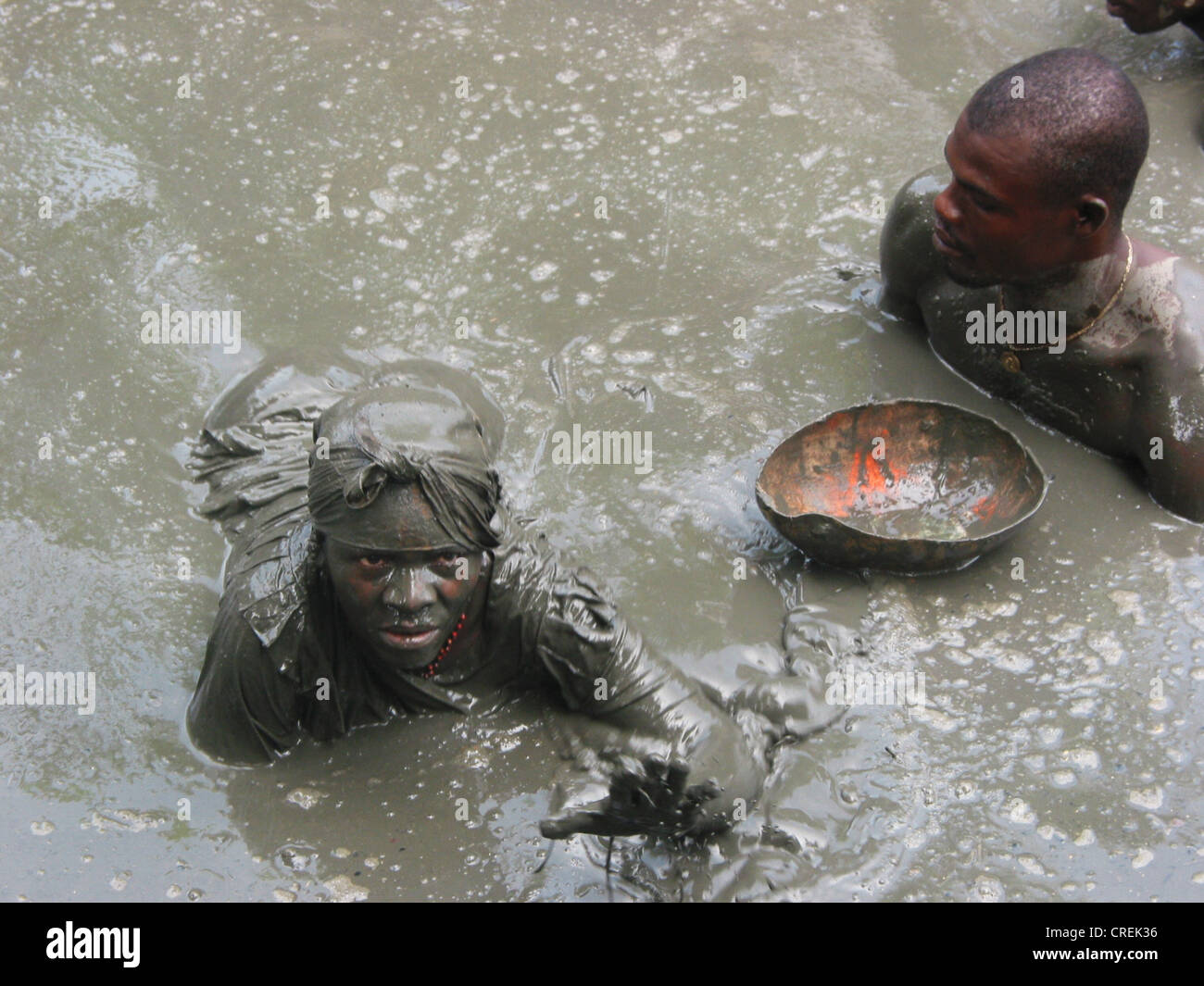 Voodoo follower in mud  in Plaine du Nord, Haiti, Plaine du Nord Stock Photo