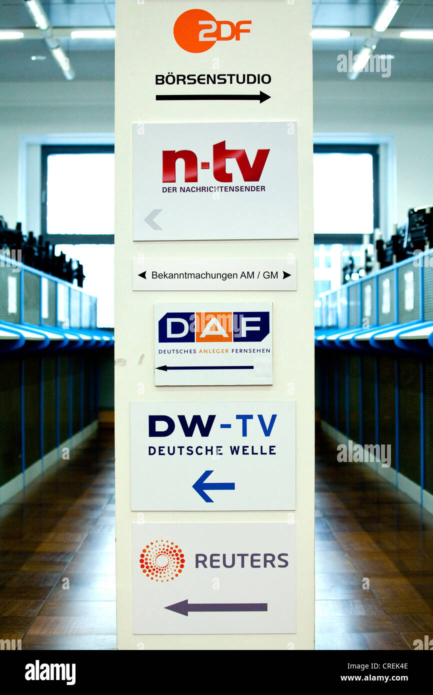 Sign with the names of TV stations that report live from the trading floor of the Frankfurt Stock Exchange, Deutsche Boerse AG Stock Photo