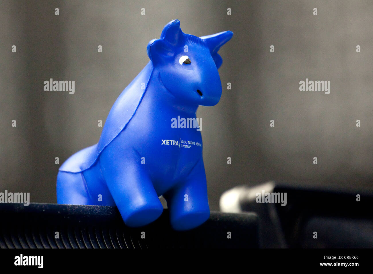 Figure of a bull standing on a screen of a stock trader on the trading floor of Frankfurt Stock Exchange, Deutsche Boerse AG Stock Photo