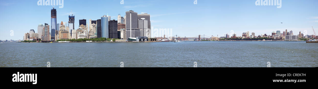 Cityscape skyline of Lower Downtown Manhattan, New York City from ferry inc Freedom Tower, panorama panoramic Stock Photo