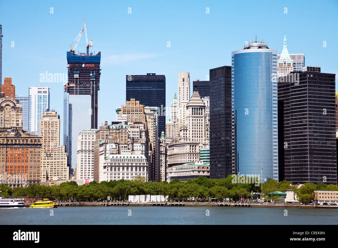 Cityscape skyline of Lower Downtown Manhattan, New York City from ferry inc Freedom Tower modern cities buildings Stock Photo