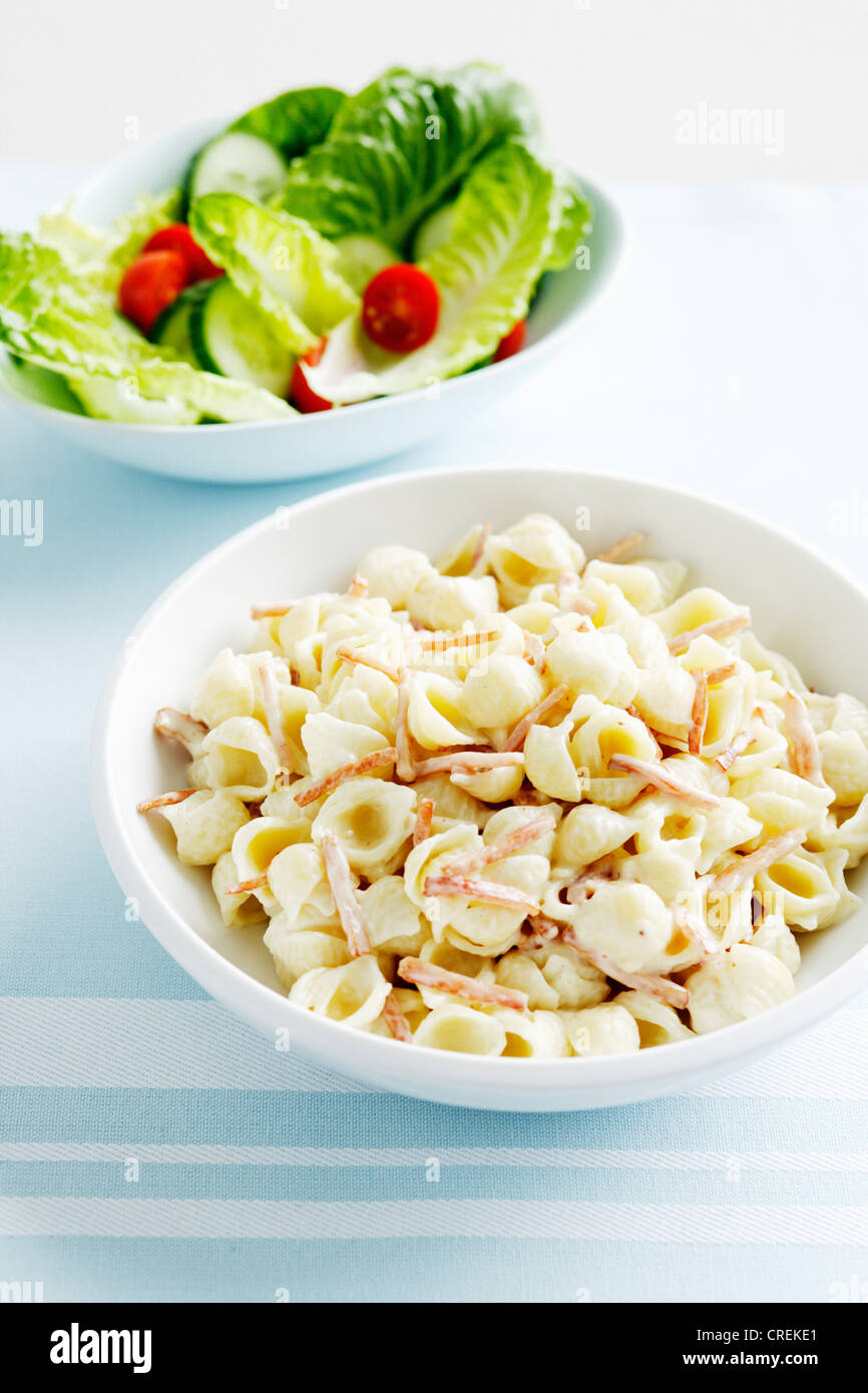 Bowls of pasta and salad Stock Photo