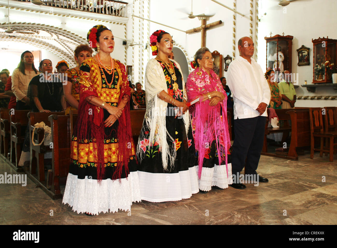 women of Juchitan, the city of the strong women, in costume during a church service, Mexico, Oaxaca, Juchitan Stock Photo