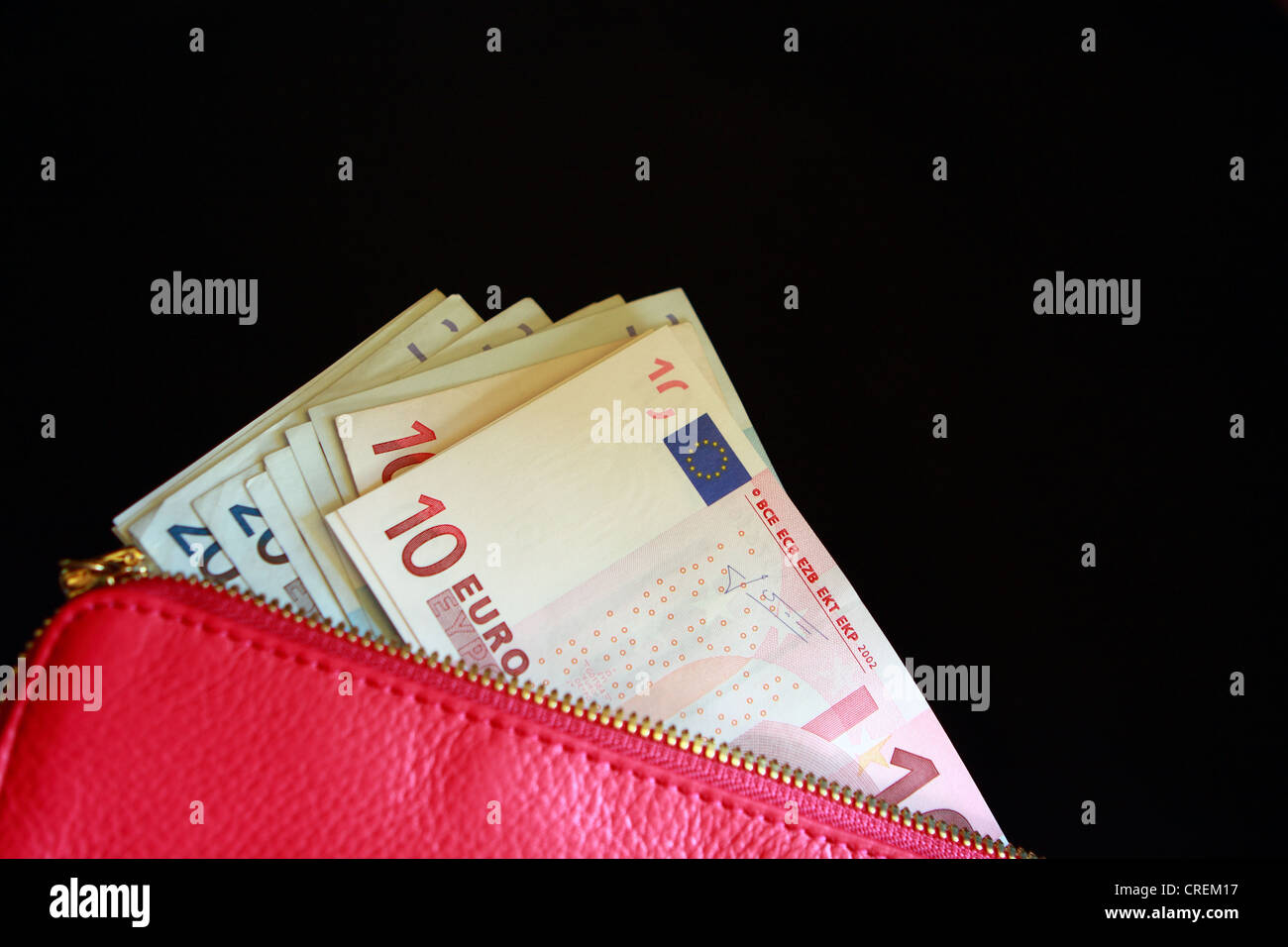 Euro notes in a lady's pink purse Stock Photo - Alamy