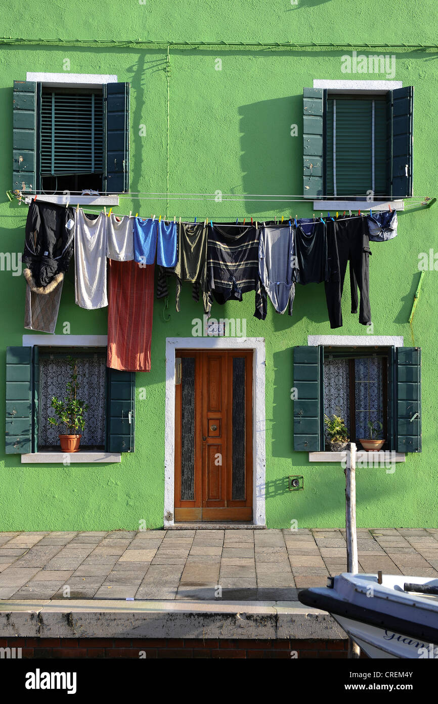 Drying laundry haning on a green house, Burano Island, Venice, Italy, Europe Stock Photo