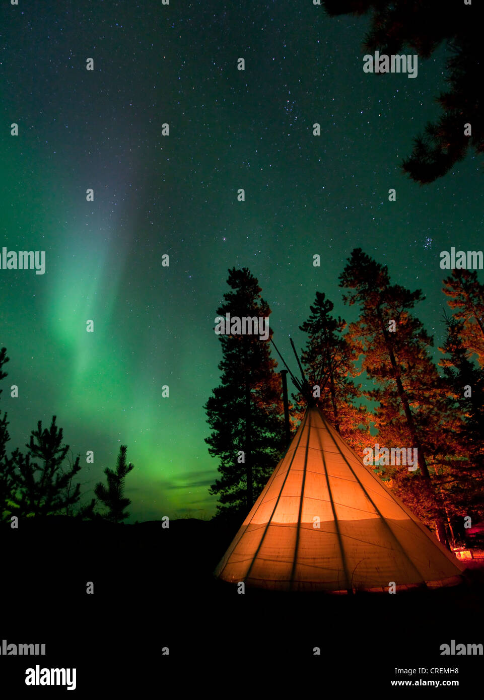 Illuminated teepee, tipi, tepee, Northern lights, Polar Aurorae, Aurora Borealis, green, near Whitehorse, Yukon Territory Stock Photo