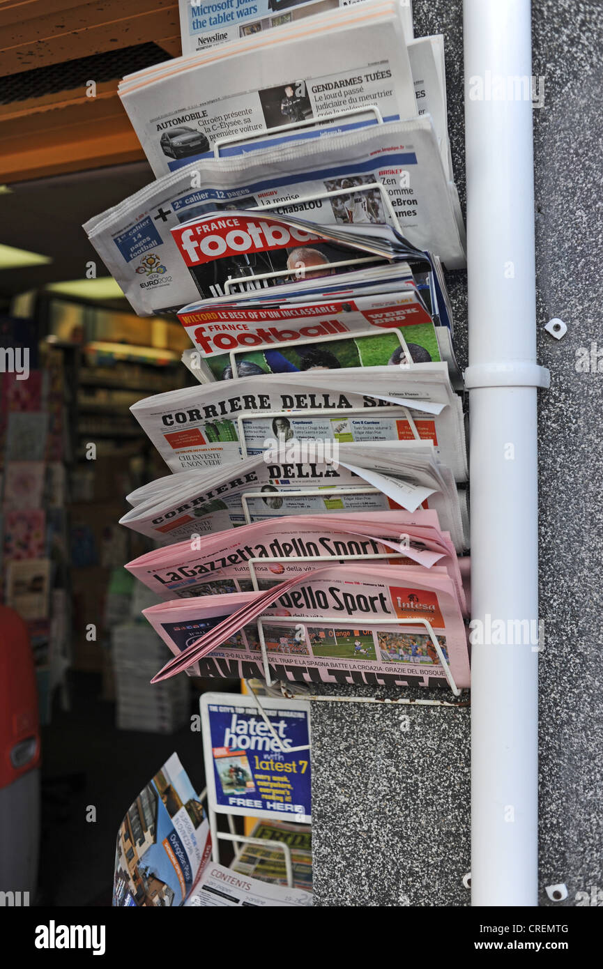 Foreign International newspapers on sale at store in famous Lanes shopping district of Brighton Sussex UK Stock Photo