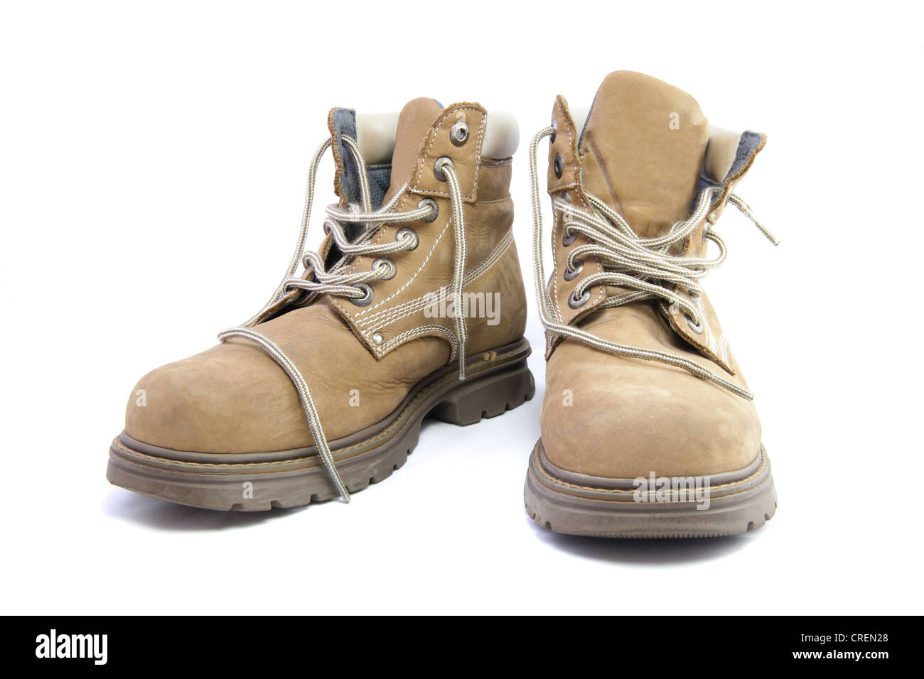 A pair of light brown work boots. Stock Photo