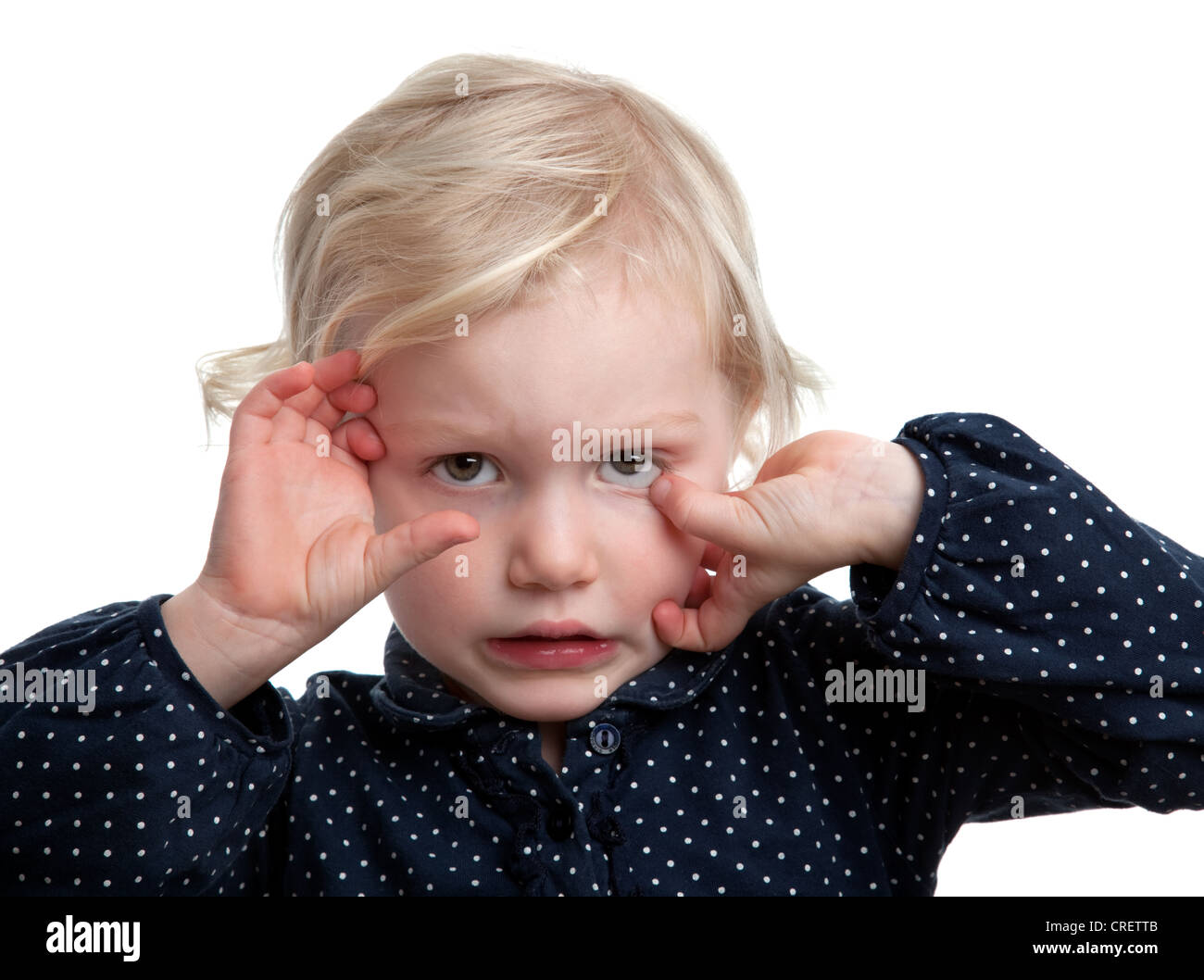 A 'Terrible Twos' shot of a moody irritable  2-3 year old girl Stock Photo