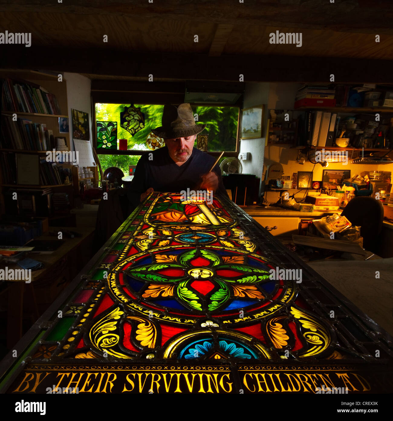 Stained Glass Window Maker Repairing Cornish Church Window Stock Photo