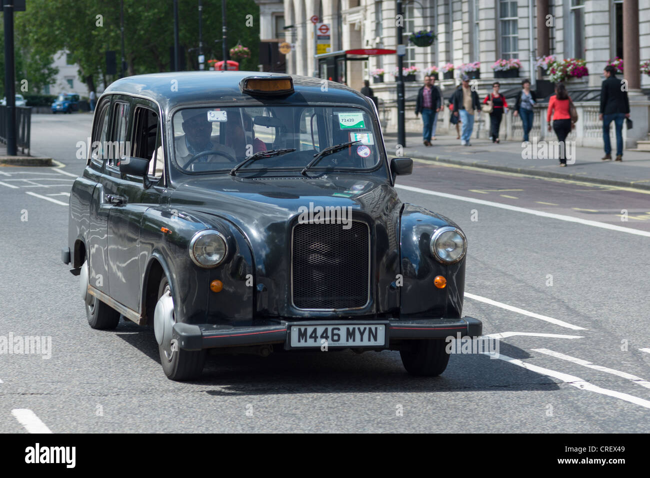 Traditional Black Taxi cab, in Piccadilly London, England. Stock Photo