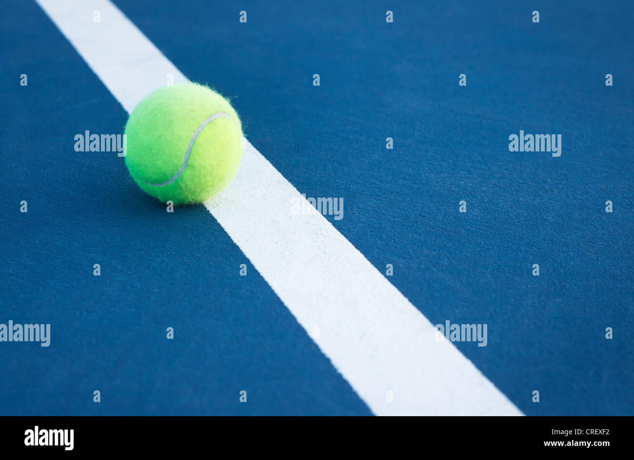 A tennis ball on the line Stock Photo Alamy