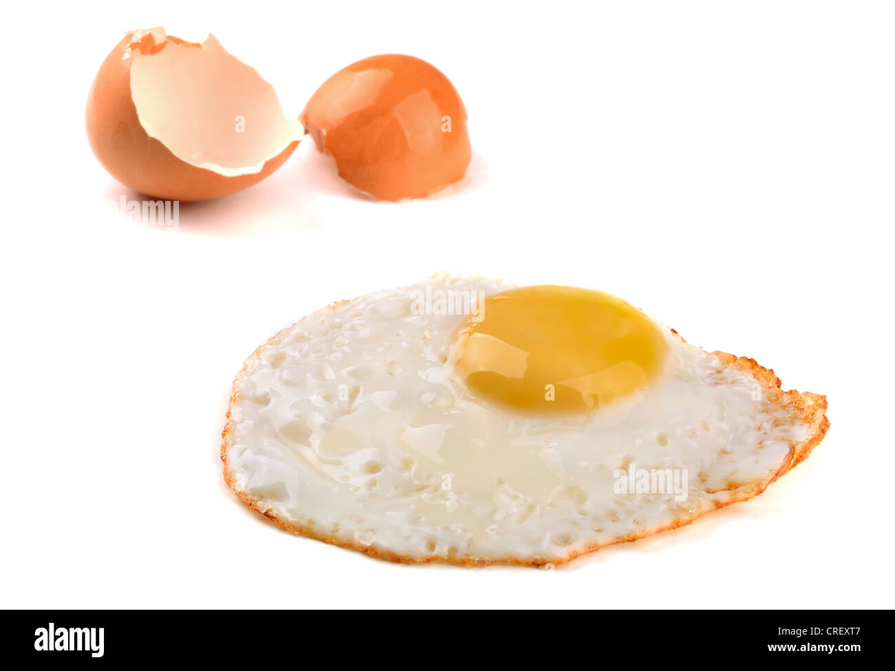Fried egg and egg shell isolated on white Stock Photo Alamy