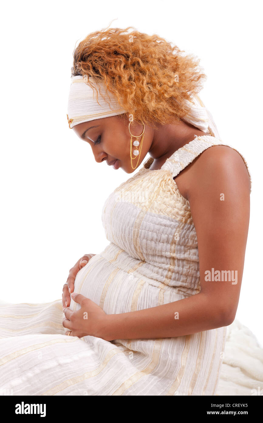 Young Beautiful Pregnant African Woman Over White Background Stock young-beautiful-pregnant-african-woman-over-white-background-stock