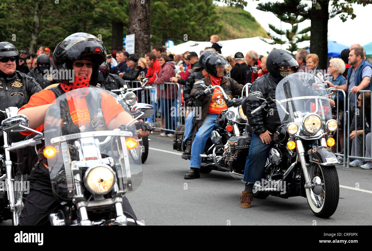 Motorcycles take part in the procession as the crowds look on Stock ...