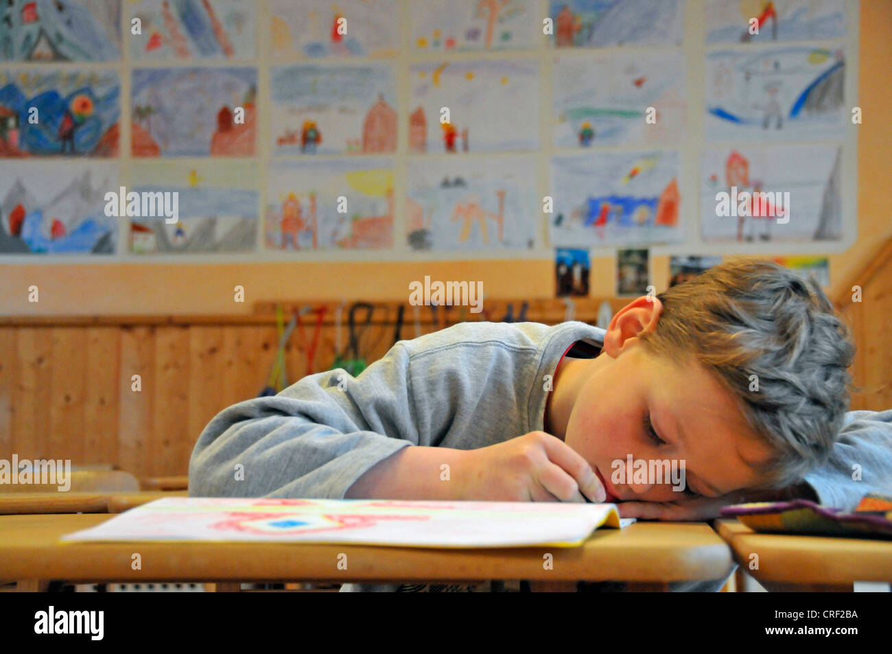 eight years old schoolboy drawing Stock Photo