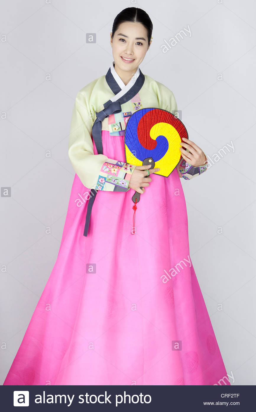 Young Woman in Korean Traditional Clothing holding Folding Fan Stock ...