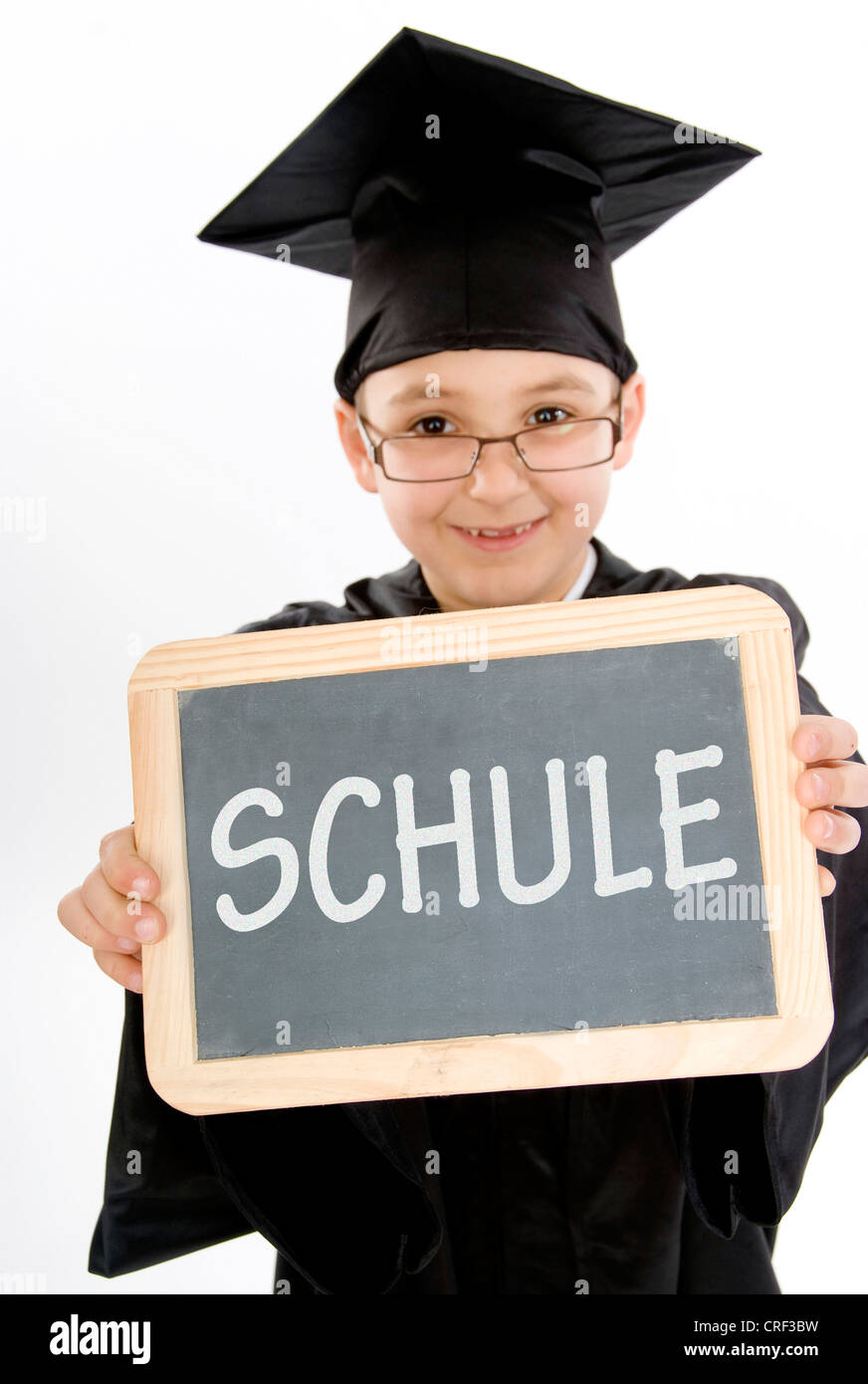 symbolic for school. Small boy as diploma holder with a blackboard Stock Photo