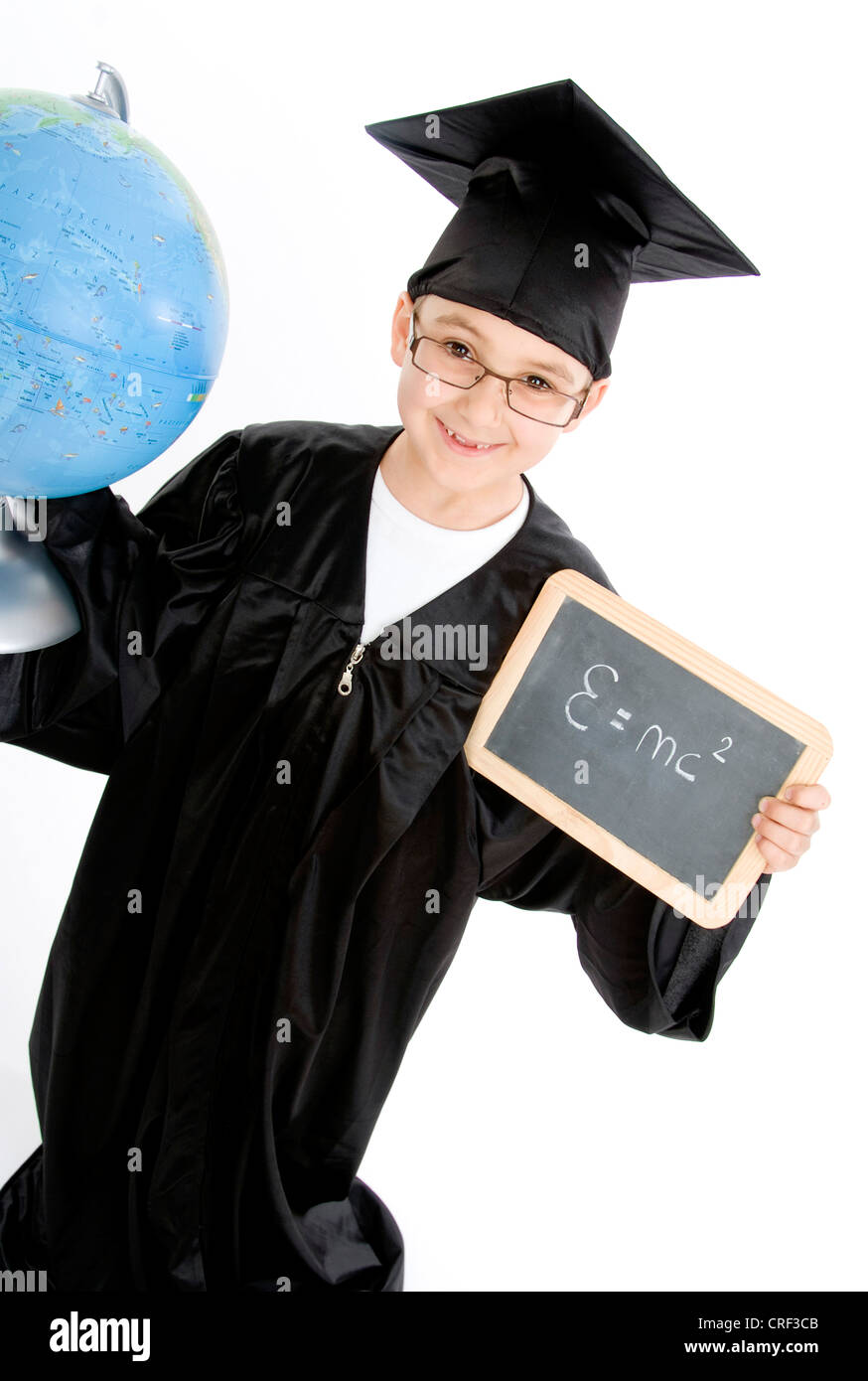small boy as diploma holder with blackboard and globe Stock Photo