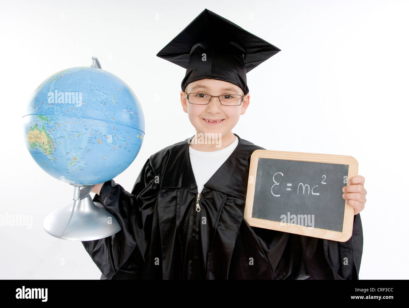 small boy as diploma holder with blackboard and globe Stock Photo