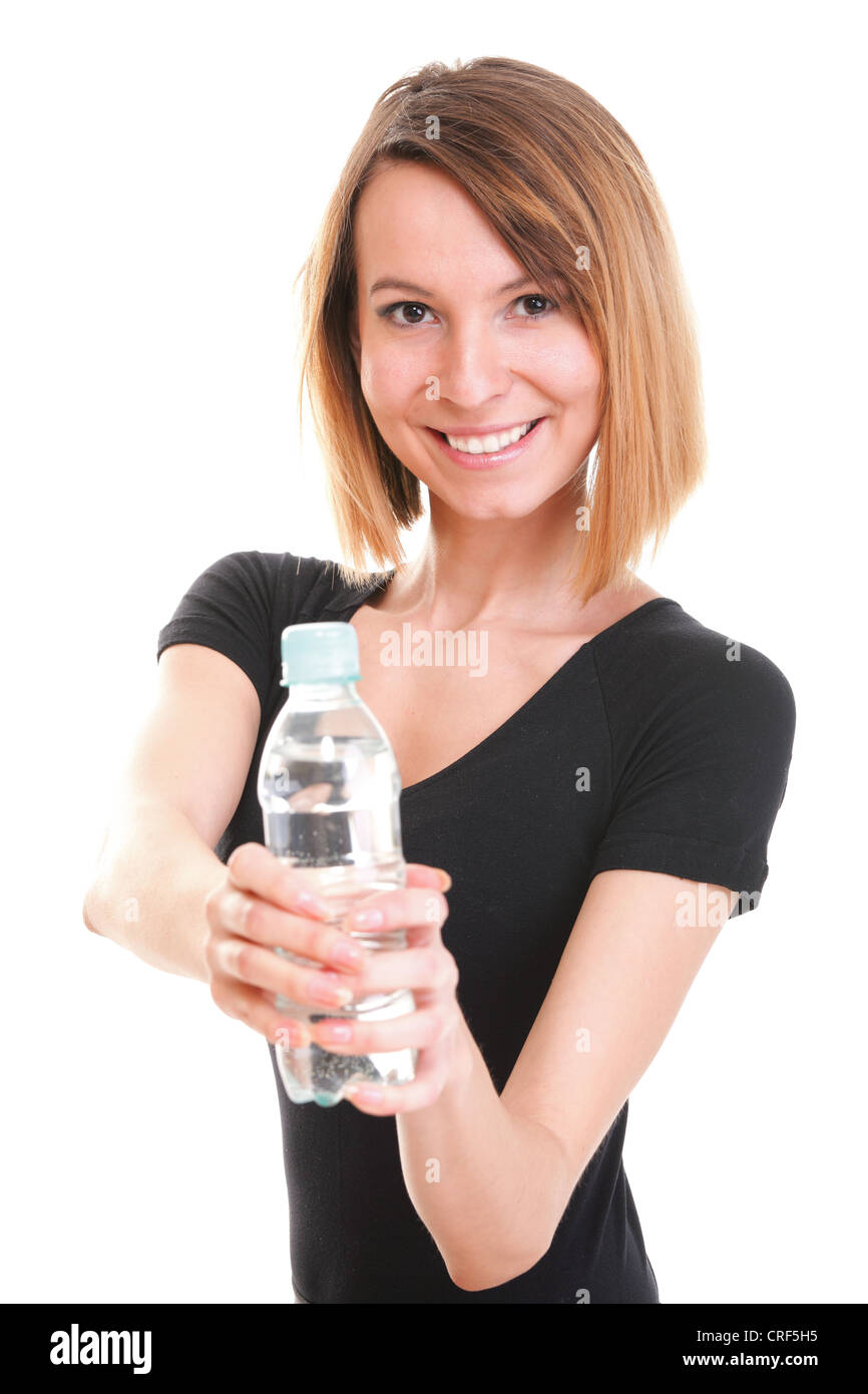 Beautiful girl drinking water from blue bottle isolated on white