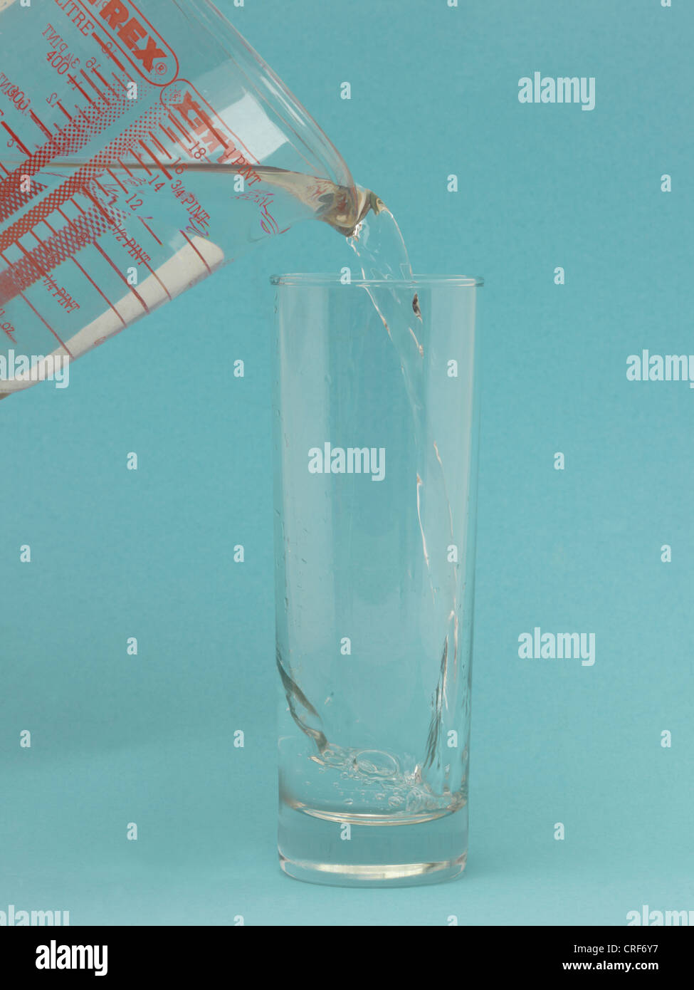 Pouring Water into a Glass Stock Photo