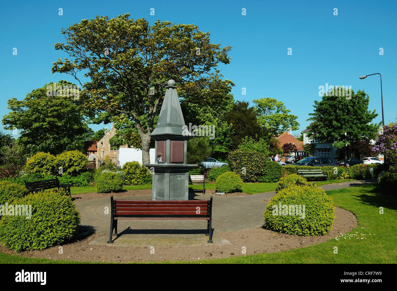 Seating bench and drinking fountain/monument in small ornate gardens by the seafront and high street at Frinton in Essex Stock Photo