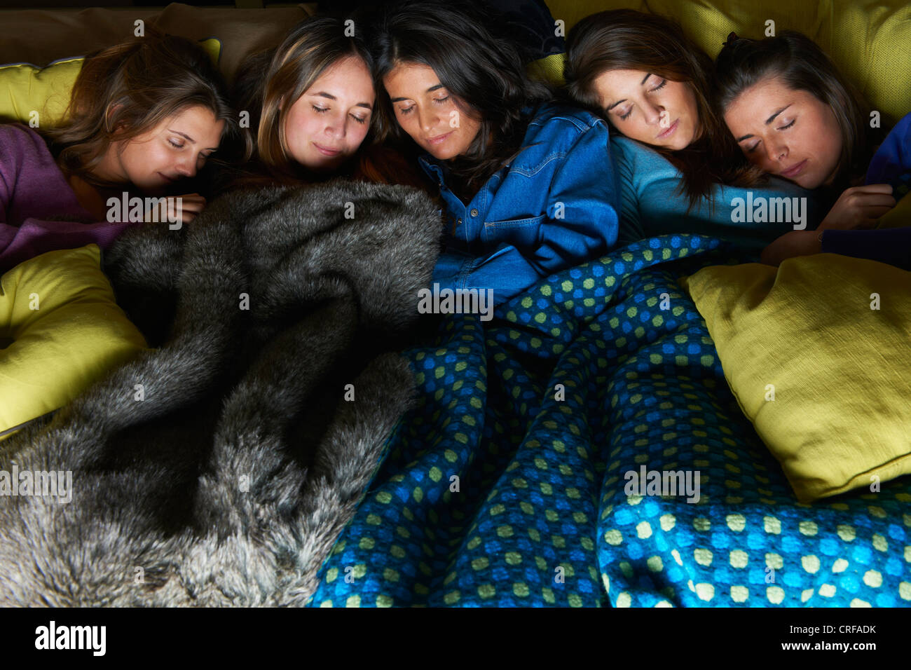 Women sleeping in bed together Stock Photo