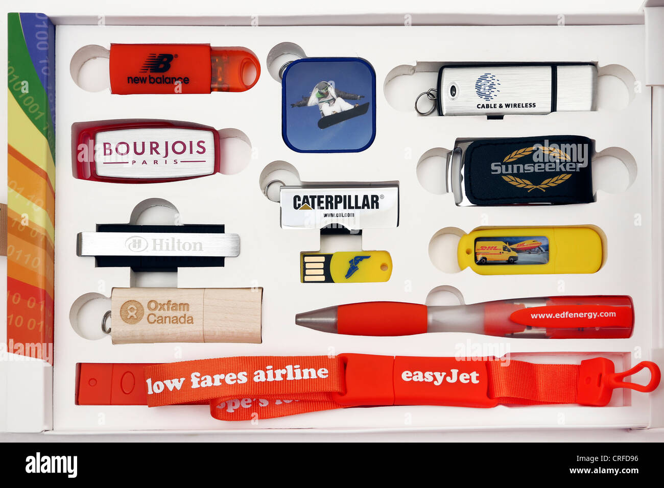 Collection Of Memory Sticks And USB Keys With Promotional Logos In A